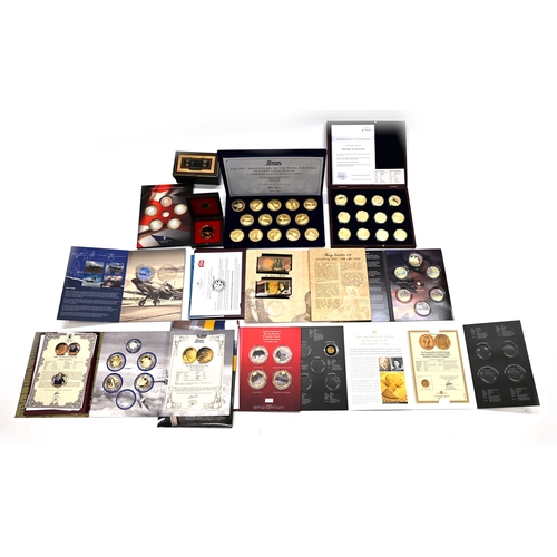 343 - A collection of Military and War related commemorative coins and medallions to include: History of A... 