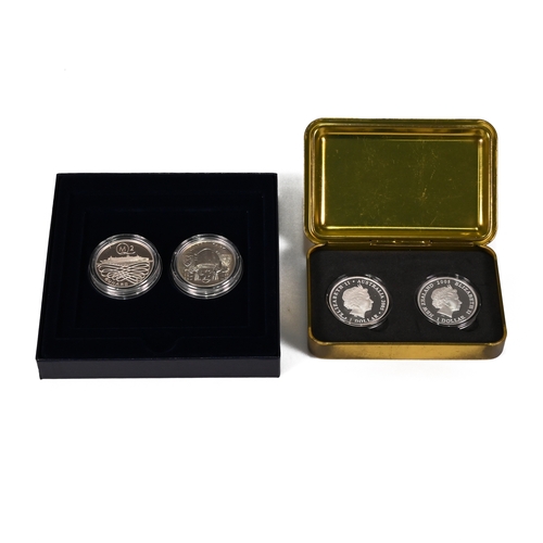 344 - A pair of boxed sets of silver medallions. One set commemorating the Queen Mary and Queen Mary 2 shi... 