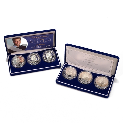 345 - A pair of Royal Mint silver proof crown coins sets to include: 2003 Prince William 21st Birthday sli... 