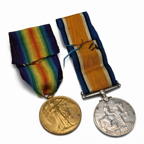 378 - A Pair of World War One medals to include the silver war medal and the victory medal issued to G. La... 