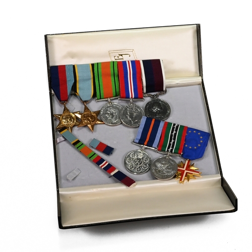 380 - A group of WWI and later medals issued to R S Becker of the Royal Air Force, they are split into two... 