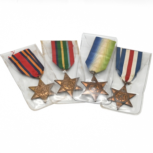 398 - A group of four World War Two star medals to include: The Atlantic Star, The Pacific Star, The Burma... 