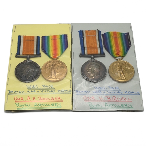 402 - Two groups of World War One medals each comprising a 1914-18 War Medal and a Victory Medal awarded t... 