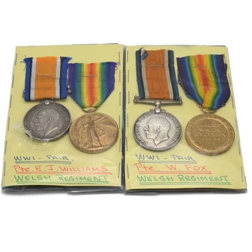 409 - Two groups of World War One medals each comprising a 1914-18 War Medal and a Victory Medal awarded t... 