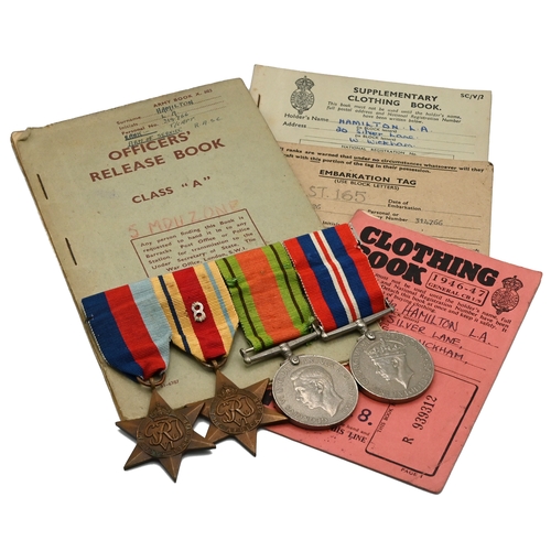 413 - A WWII Medal group comprising: a 1939-45 Star; Africa Star (with 8th Army insignia sewn on); Defence... 