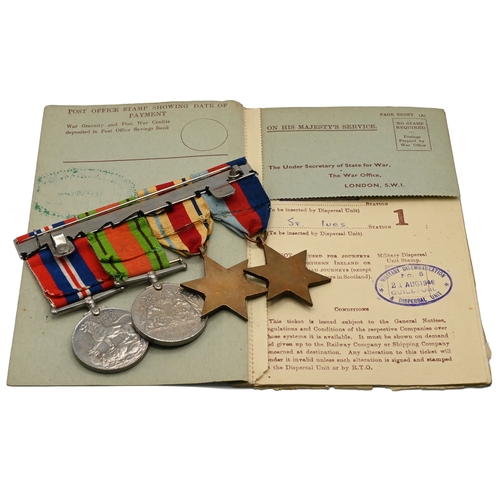 413 - A WWII Medal group comprising: a 1939-45 Star; Africa Star (with 8th Army insignia sewn on); Defence... 