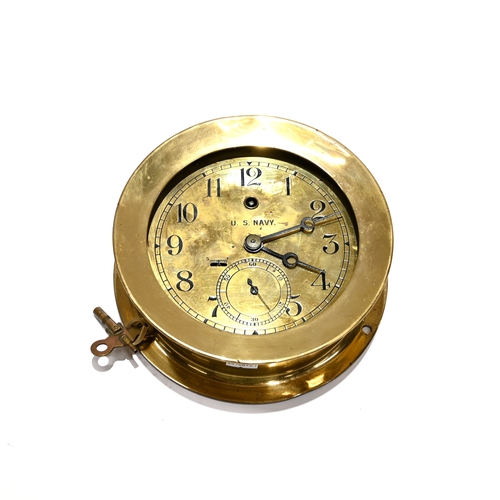 432 - A WW1 US Navy solid Brass Bulkhead Clock by Chelsea Clock Company, Boston. Both the clock and housin... 