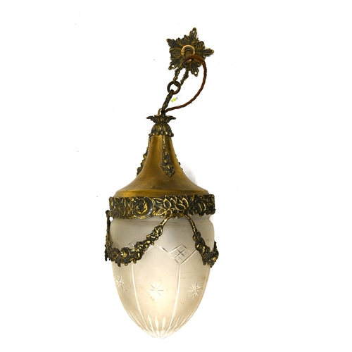 443 - A well cast brass and glass ceiling lamp which dates to the early 20th Century. Cast brass body and ... 