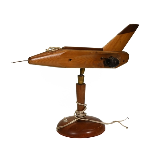 447 - A novelty 1950's wooden lamp in the form of a Jet Aeroplane. A shaped shade on either side wouldmost... 