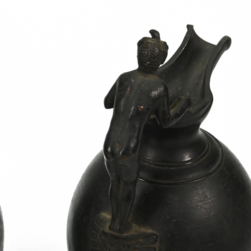 449 - A 19th century bronze Grand Tour bulbous pitcher, the handle formed of reclining classical lady. Alo... 