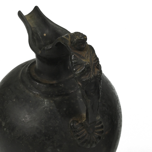 449 - A 19th century bronze Grand Tour bulbous pitcher, the handle formed of reclining classical lady. Alo... 