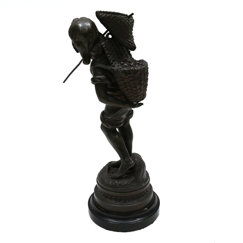 465 - A spelter figure of a boy cockle picker on ebonised wooden socle. Height 49cm (inc socle) 45cm (figu... 