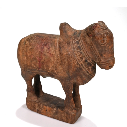 467 - A carved 20th century hard wood Indian Nandi bull. H 26cm, L 24cm, D 8cm.