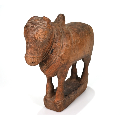 467 - A carved 20th century hard wood Indian Nandi bull. H 26cm, L 24cm, D 8cm.