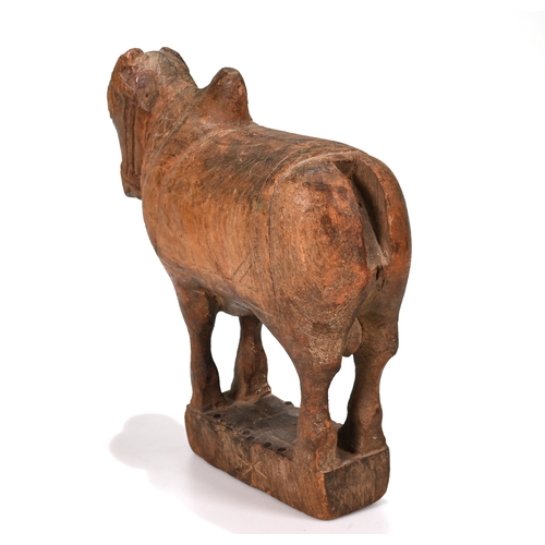 467 - A carved 20th century hard wood Indian Nandi bull. H 26cm, L 24cm, D 8cm.