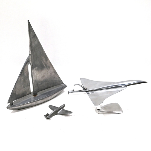 469 - Three (3) sculptures- A contemporary metal sailing boat marked 'Nauticalia, London' to the underside... 