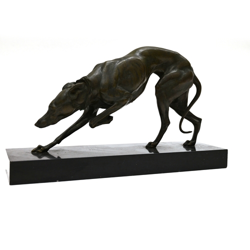 471 - A well patinated bronze study of a prowling Greyhound, finely figured, on a rectangular marble base.... 