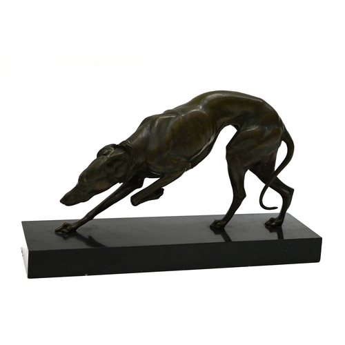 471 - A well patinated bronze study of a prowling Greyhound, finely figured, on a rectangular marble base.... 