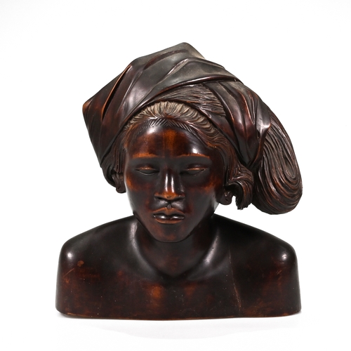 474 - A carved hardwood bust of an African lady. H 29cm, W 26cm, D 20cm.