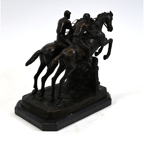 477 - A dark brown patinated bronze sculpture of two racing horses and their jockeys taking a fence in a s... 