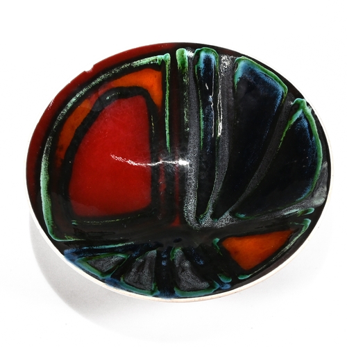 489 - A 1970's Poole Pottery bowl, model number 57, abstract glazed in red, amber, blue, green and black. ... 