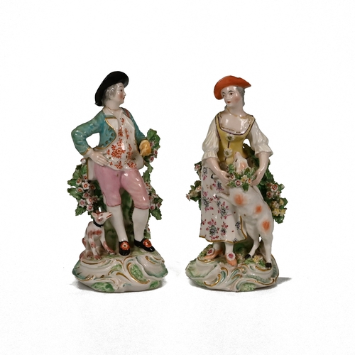 497 - A hand painted 18th century porcelain shepherd and shepherdess, possibly Derby. The shepherdess and ... 