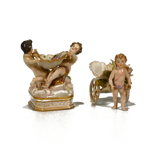 498 - Two 19th Century bonbon dishes. The first in the form of two cherubs holding a basket all decorated ... 