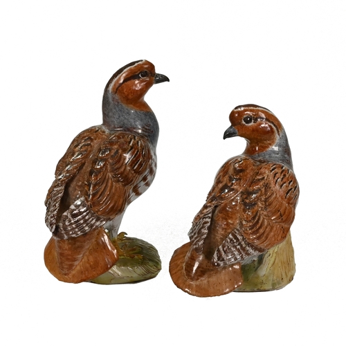 508 - A pair of white glazed, red clay quails modelled by Lady Anne Gordon and bearing her monogram and th... 