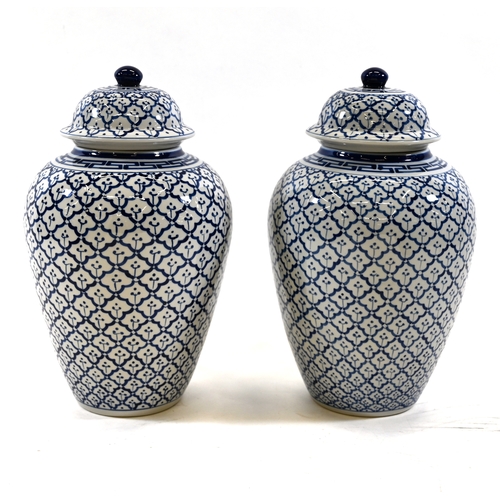 523 - A pair of large baluster form Blue and White Temple jars with lids. pineapple tiled decoration. Dime... 