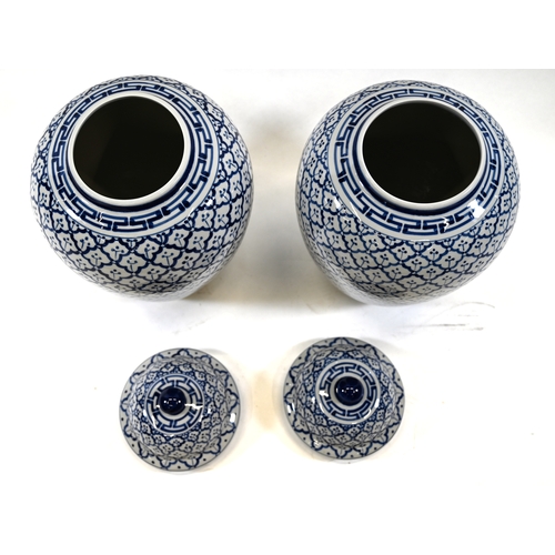 523 - A pair of large baluster form Blue and White Temple jars with lids. pineapple tiled decoration. Dime... 