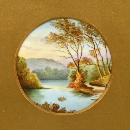 528 - A pair of 19th Century circular ceramic plaques (8.7cm diameter) each painted with landscape scenes,... 