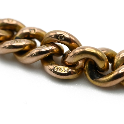 53 - A 9 carat gold watch chain, of solid uniform curb links, 40.5cm long, 38.1 grams gross. 