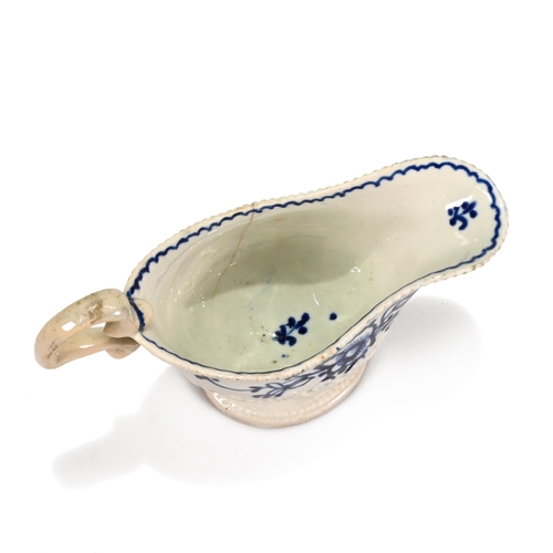 533 - A John Pennington of Liverpool porcelain blue and white over-glaze creamer. The foot with beaded mou... 