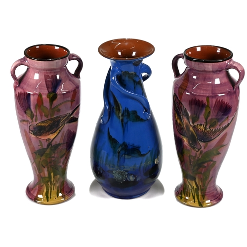 538 - A pair of items of art nouveau Lemon and Crute pottery (Torquay ware) double handed vases, with purp... 