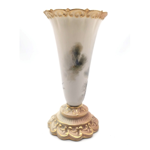 549 - A Royal Worcester blush ivory trumpet vase hand painted with pheasants in a landscape by James Stint... 