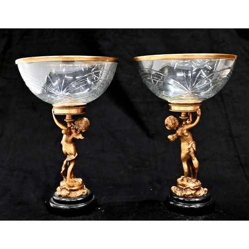 559 - A near pair of continental Empire style cut glass bowl Tazza's each with a brass rim and supported b... 