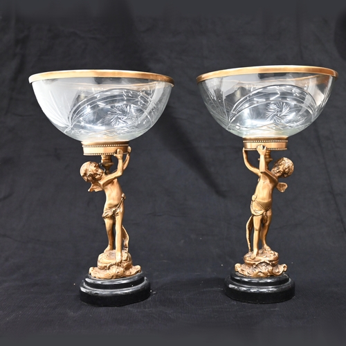 559 - A near pair of continental Empire style cut glass bowl Tazza's each with a brass rim and supported b... 