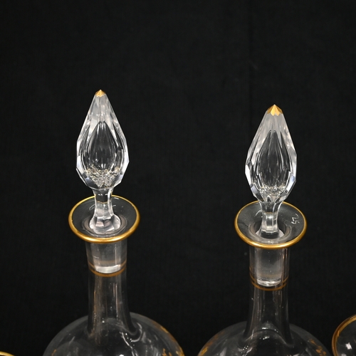 562 - A pair of slender teardrop shaped 19th century continental liqueur or cordial decanters with gilt en... 