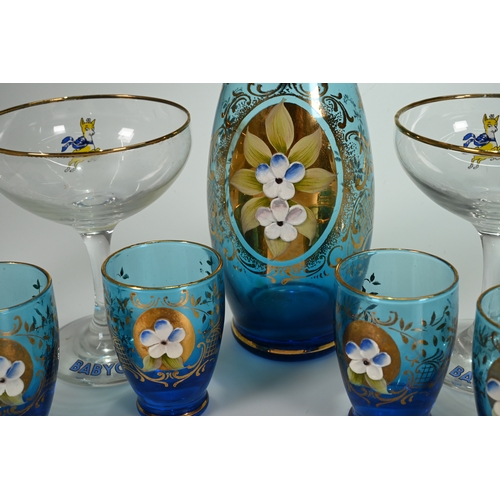 565 - A Moser blue glass decanter with stopper (29cm) and six cordial/liqueur glasses (6.8cm), with gilt s... 