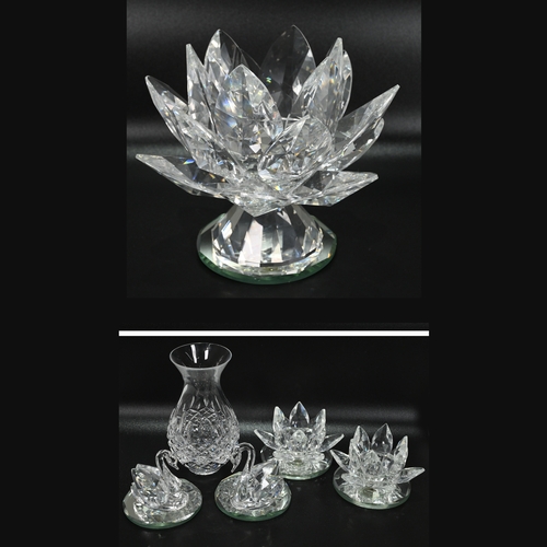 568 - Glassware to include a collection of Swarovski glass comprising: A large (12cm) Waterlily candle hol... 