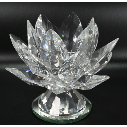 568 - Glassware to include a collection of Swarovski glass comprising: A large (12cm) Waterlily candle hol... 