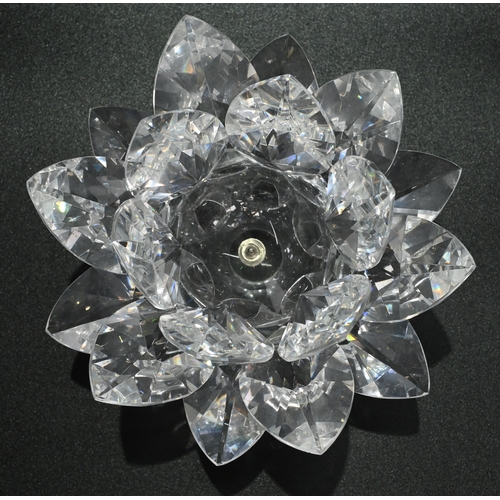 568 - Glassware to include a collection of Swarovski glass comprising: A large (12cm) Waterlily candle hol... 