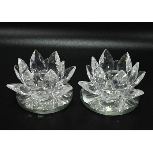 568 - Glassware to include a collection of Swarovski glass comprising: A large (12cm) Waterlily candle hol... 