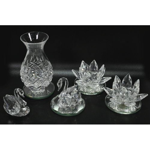 568 - Glassware to include a collection of Swarovski glass comprising: A large (12cm) Waterlily candle hol... 