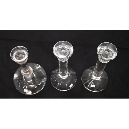 574 - A pair of contemporary large glass candlesticks and a smaller single glass candlestick (3). Pair eac... 