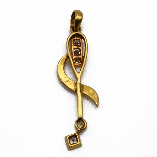 61 - A gold abstract diamond set pendant, unmarked, set with three Princess cut stones and a similar cut ... 