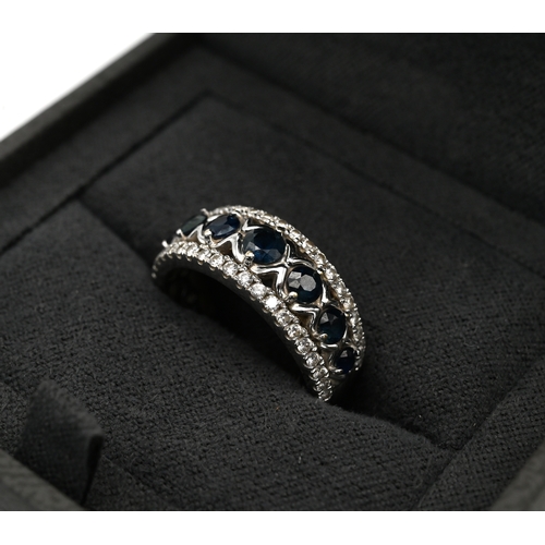 62 - An 18ct white gold, diamond and sapphire Vera Wang love ring, set with seven sapphires and 0.29 cara... 