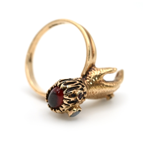 71 - A 9 carat gold hand ring, set with various gems, finger size N, 4.4 grams gross.  