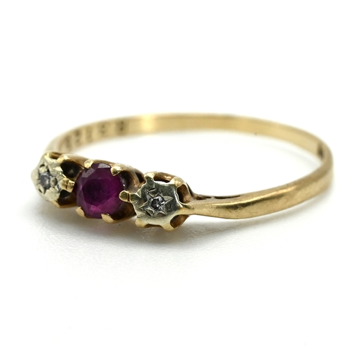 73 - A 9 carat gold ruby and illusion set diamond three stone ring, 1.4 grams gross. 