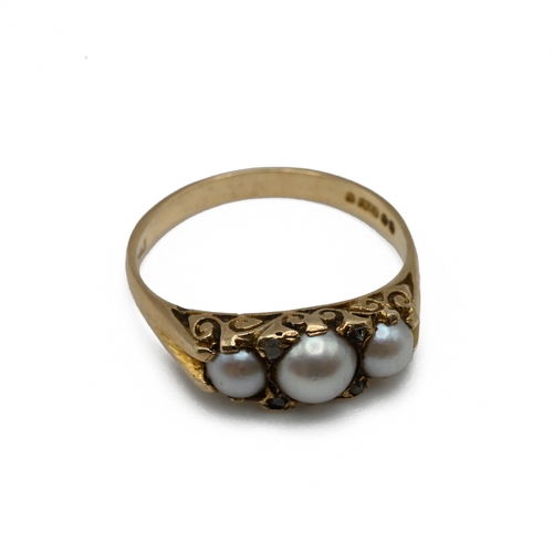 74 - A 9 carat gold three stone cultured pearl dress ring, with rose cut diamonds between, finger sizeM, ... 